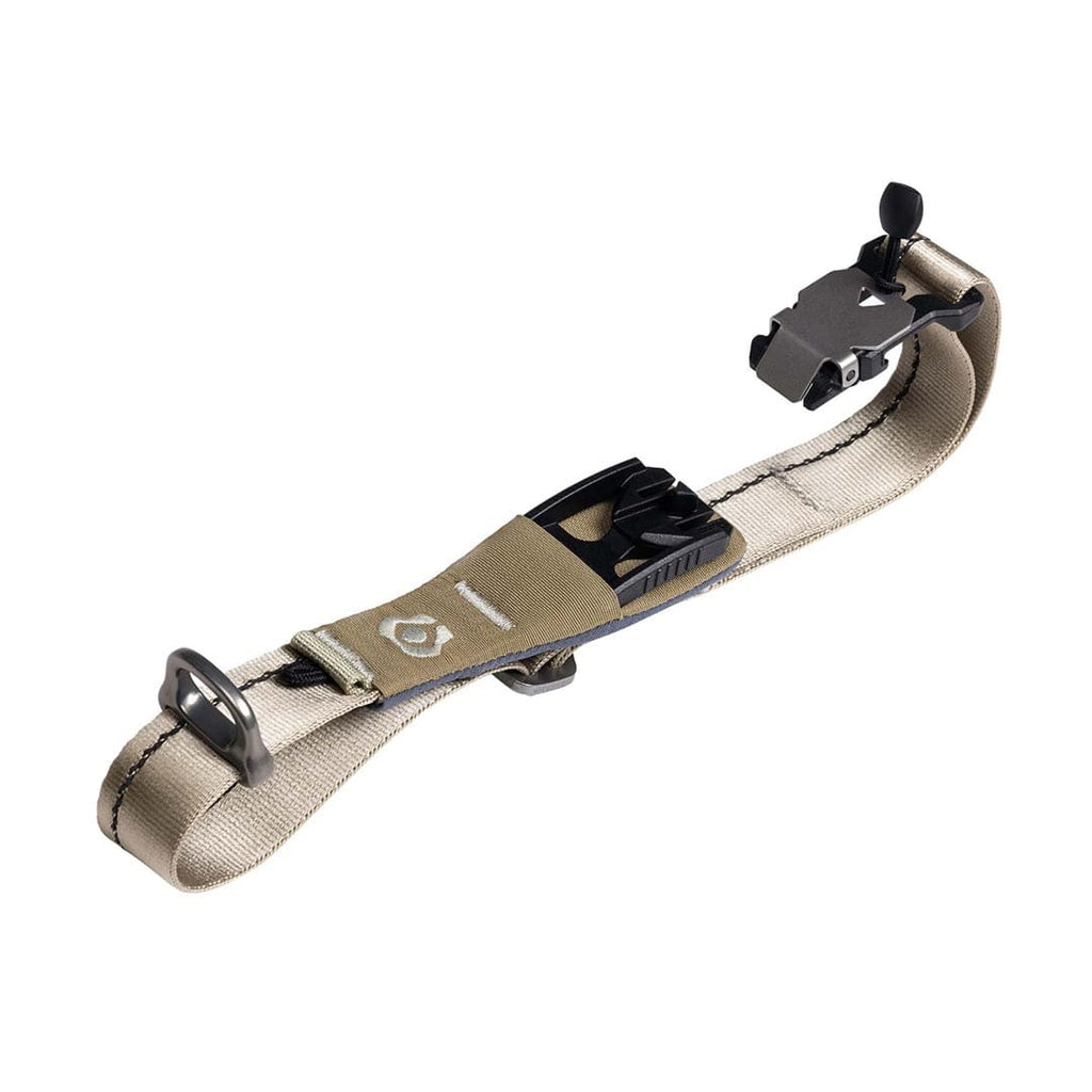 Tan dog collar with black hardware on a white background