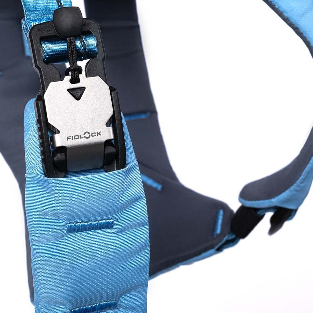 Close-up of a blue and black climbing harness with Fidlock brand visible.