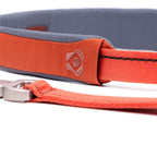 Dog leash with gray and orange design on a white background