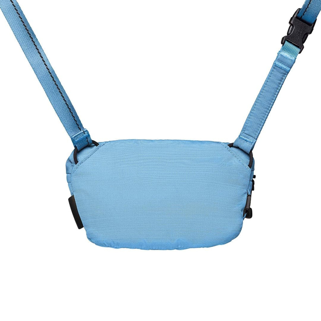 Blue baby carrier with straps on a white background