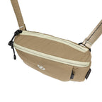 Beige waist bag with a visible brand logo on a white background