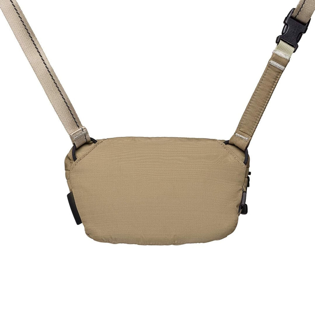 Tan shoulder bag with straps on a white background