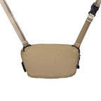 Tan shoulder bag with straps on a white background