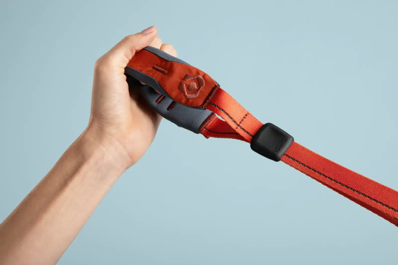 Hand gripping the Quick Grip handle on the leash