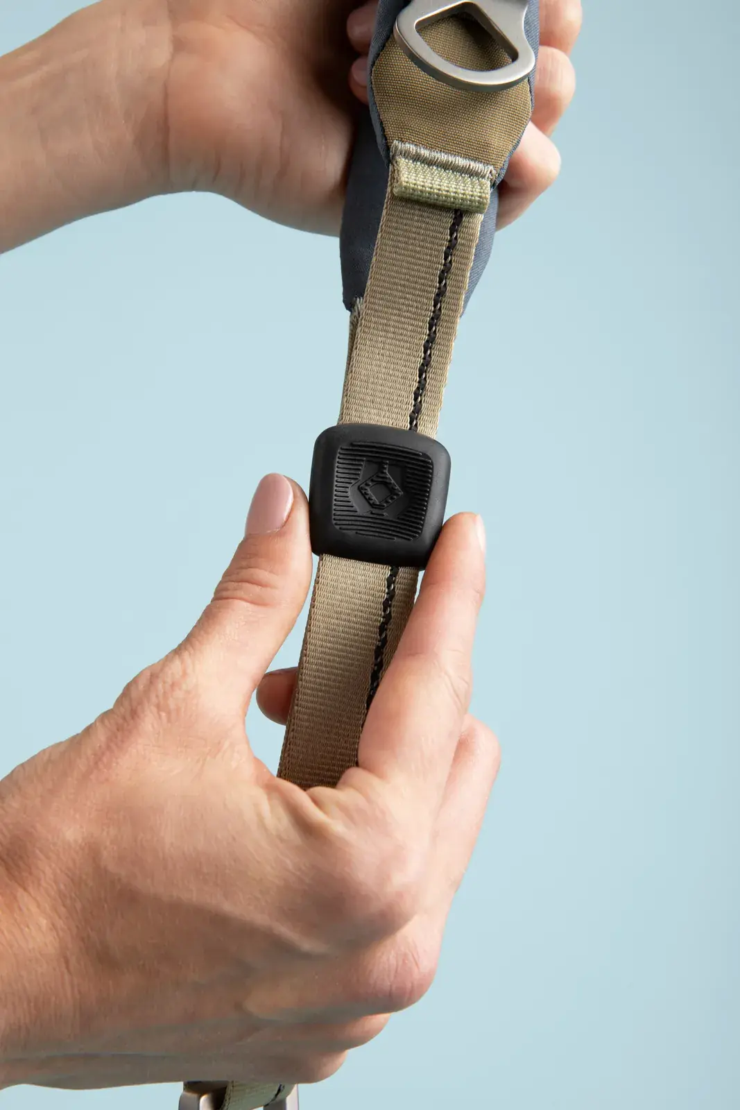 Hands adjusting the Quick Grip clamp